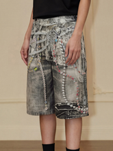 Distressed shorts with 3D pearl chain print